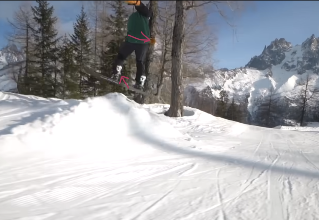 Snowboarder performing a trick mid air
