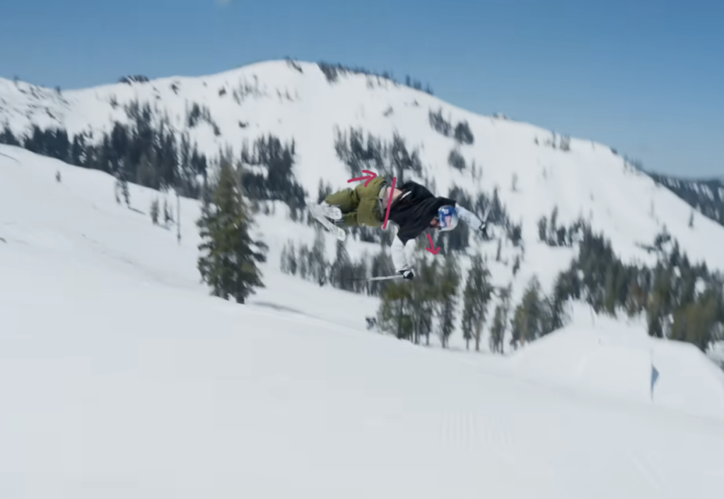 Skier performing second part of trick