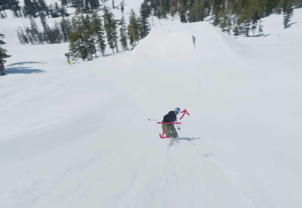 Skier performing fourth part of trick