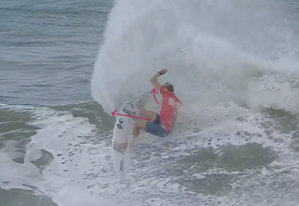 Surfer loading up for a turn in a wave