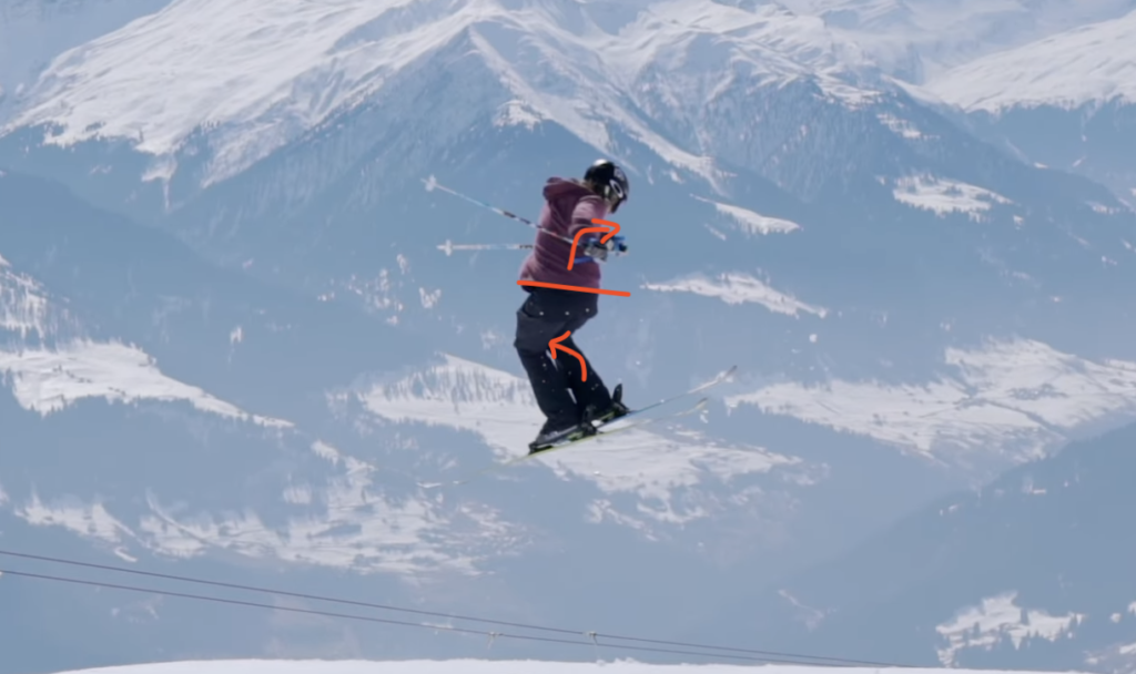 Skiier performing a shifty mid air