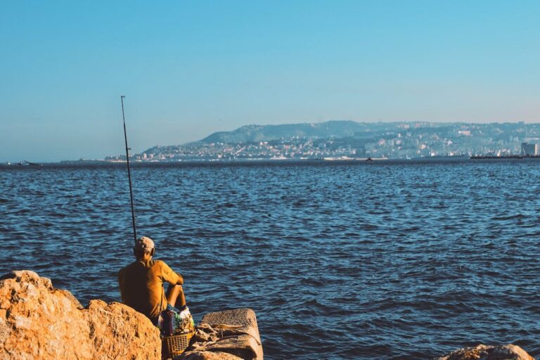 A photo of a fisherman next the Algerian Ocean