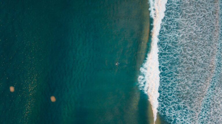 A ariel drone photo of surfer in a European country