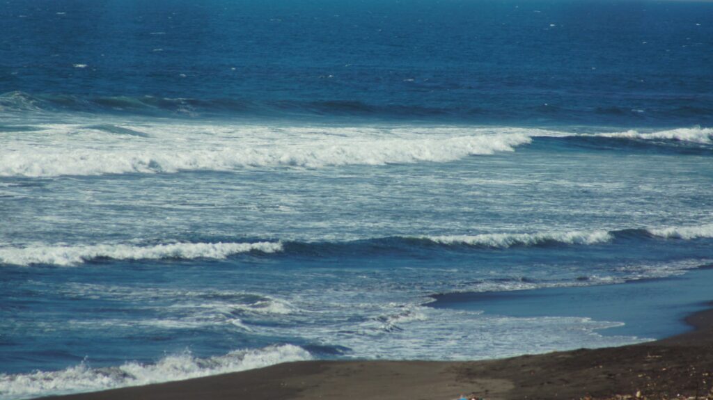 Guatemala beach with breaking waves and wind
