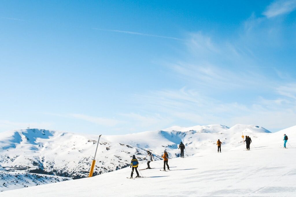 A handful of people skiing on a ski resort