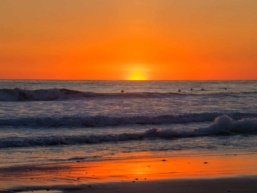 Beautiful Beach of Playa Grande with the sunset in the background