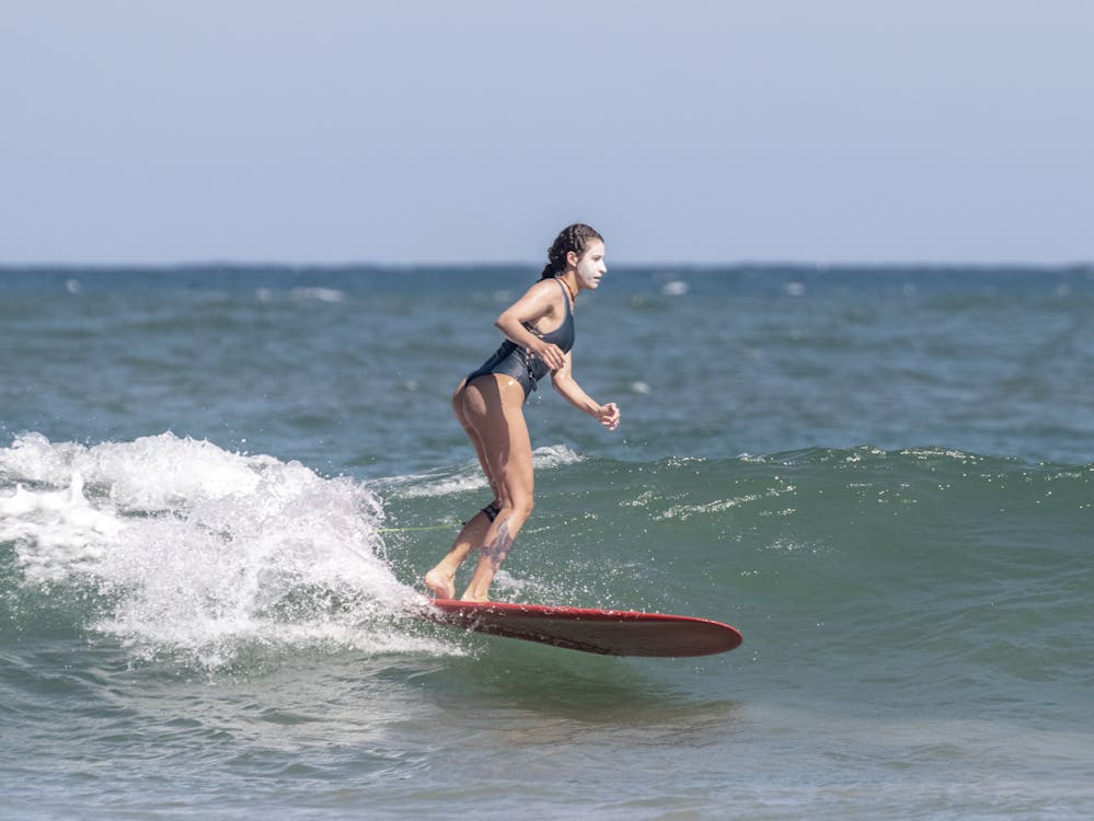 Girl longboarding surfing