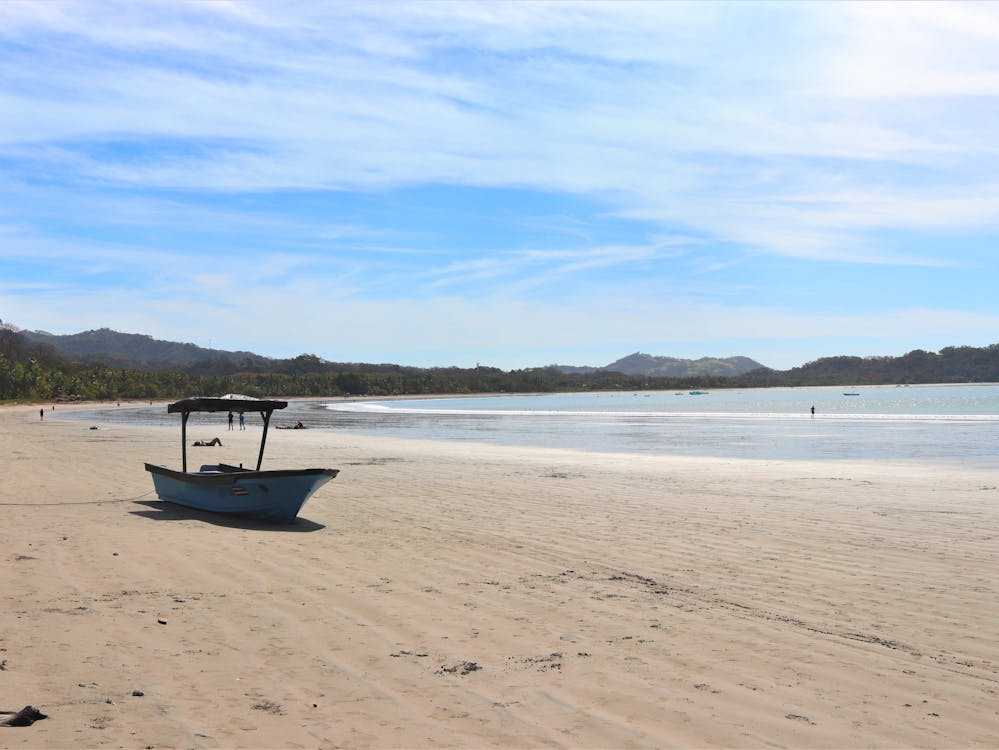 Samara Costa rica beach with a boat on shore