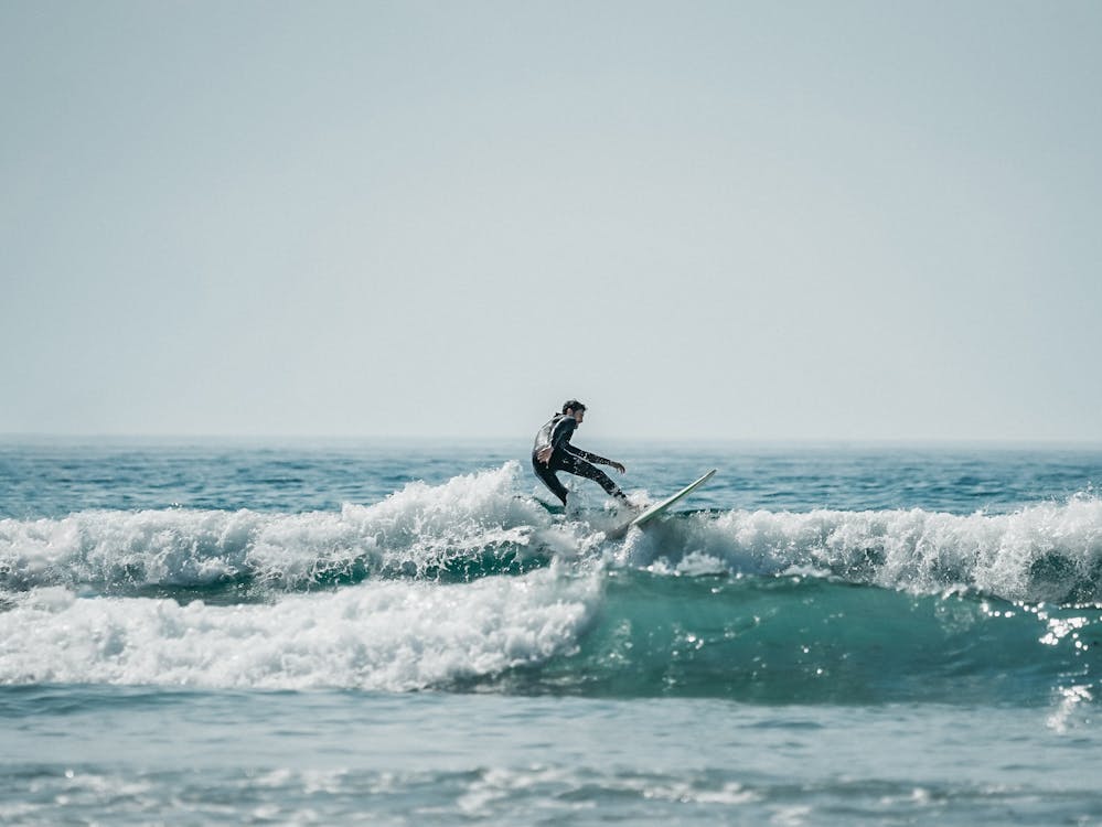 Surfing riding a wave in Popoyo