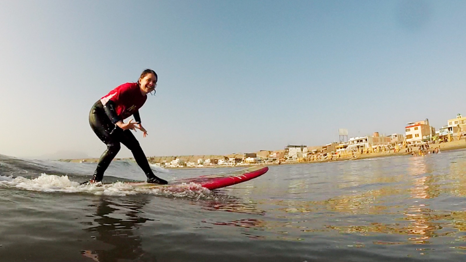 A rider having a great time on a wave with Muchik surf school.