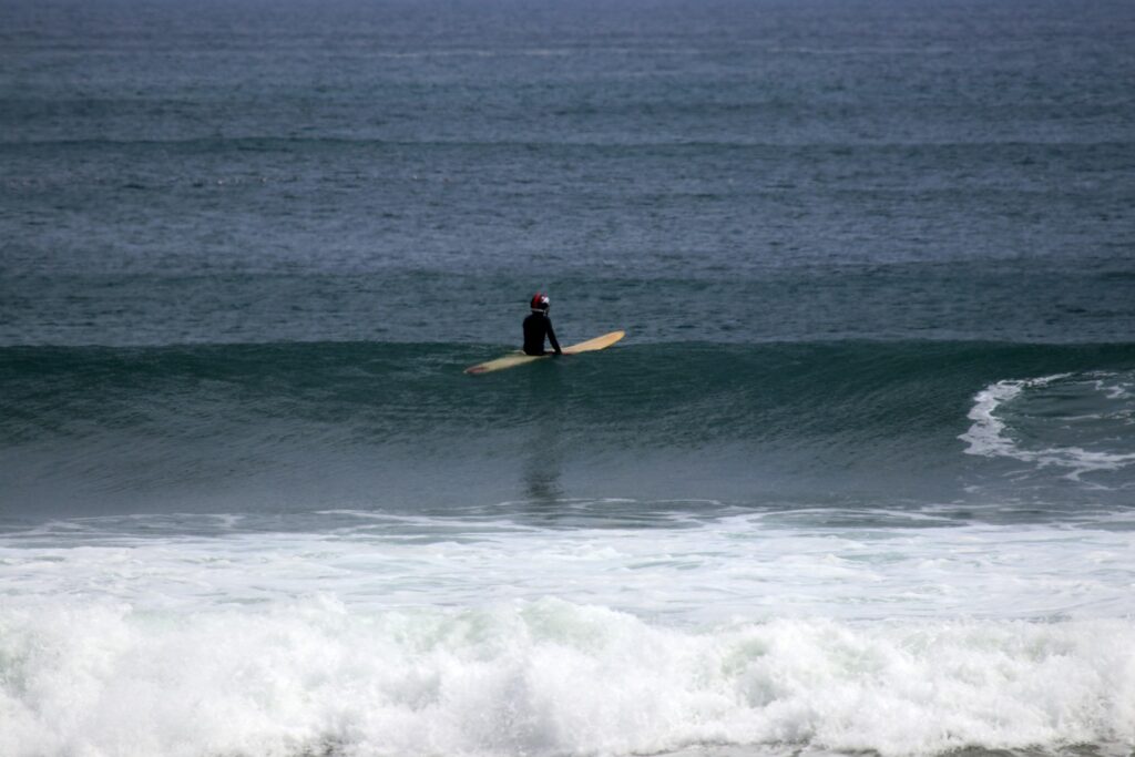 Surfer waiting in the water El Palmar