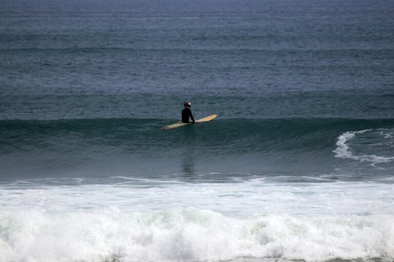 Surfer waiting in the water El Palmar