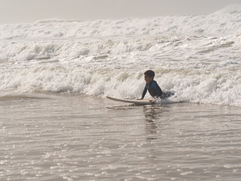 Kid learning to surf