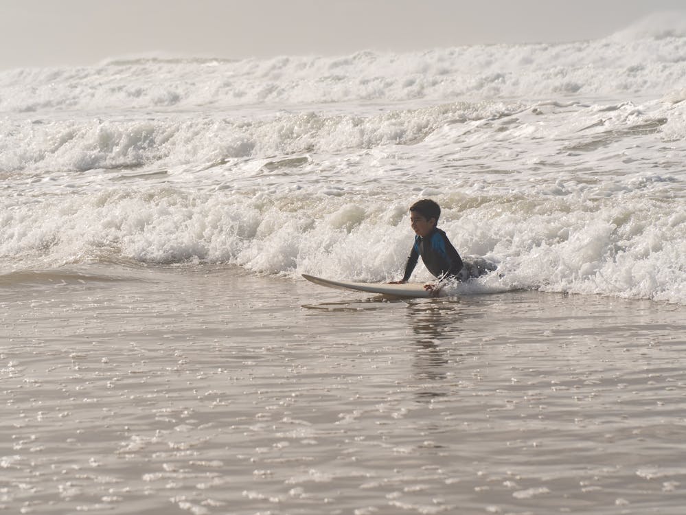 Kid learning to surf