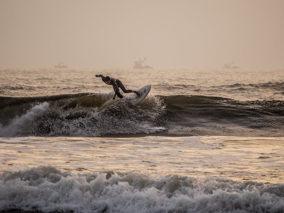 Surfer riding a left point break