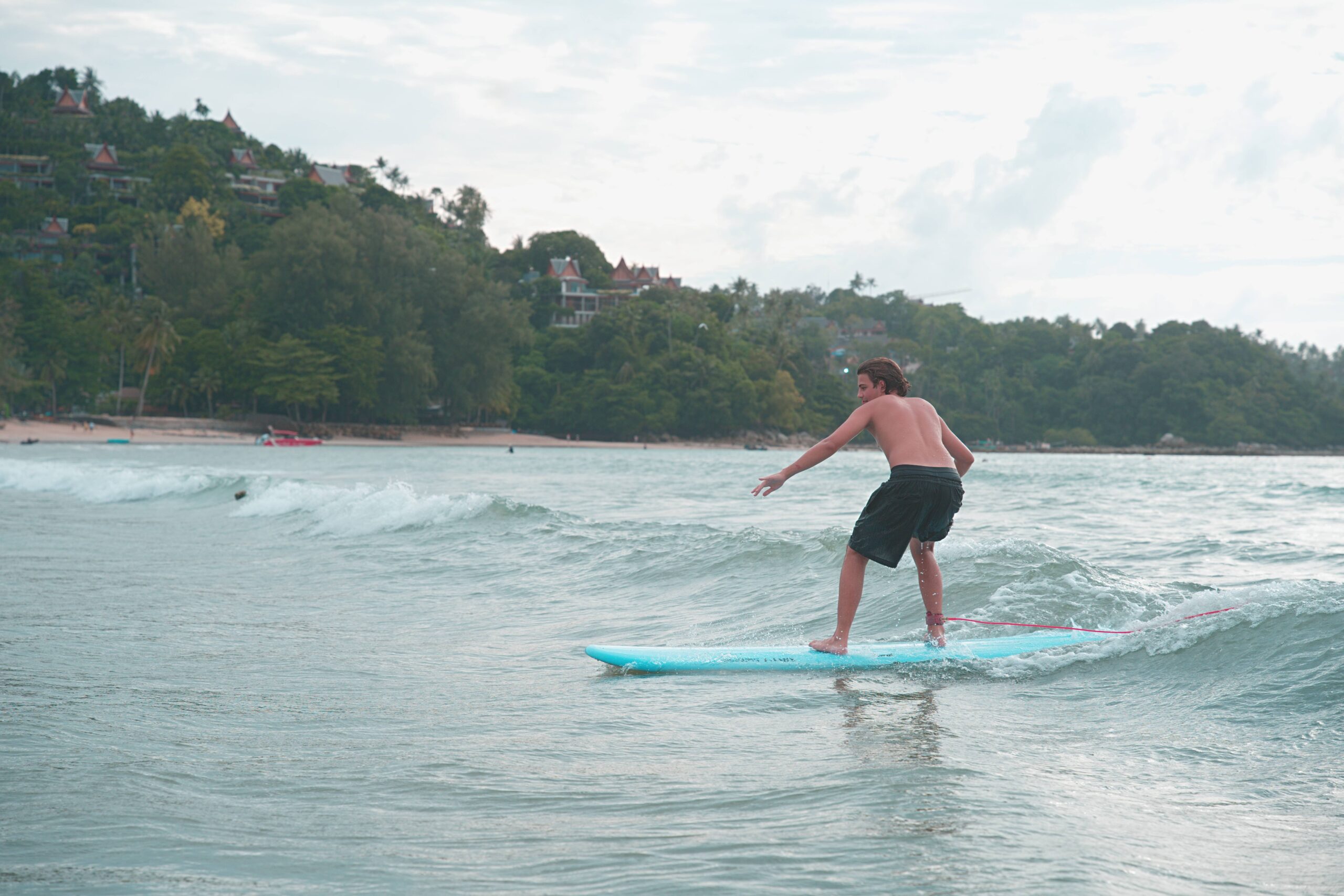 A beautiful shot of one of the students from Bang Tao Surf enjoying a wave.