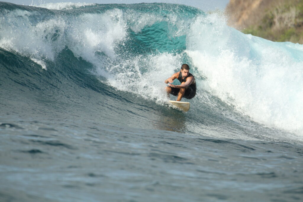 A LMBK Surf House improving their technique on some intermediate waves.