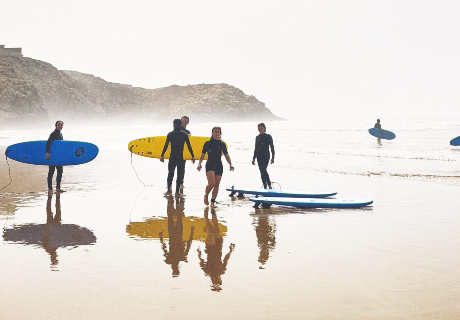 A group of beginners heading out for their lesson with Moja Surf Maroc.