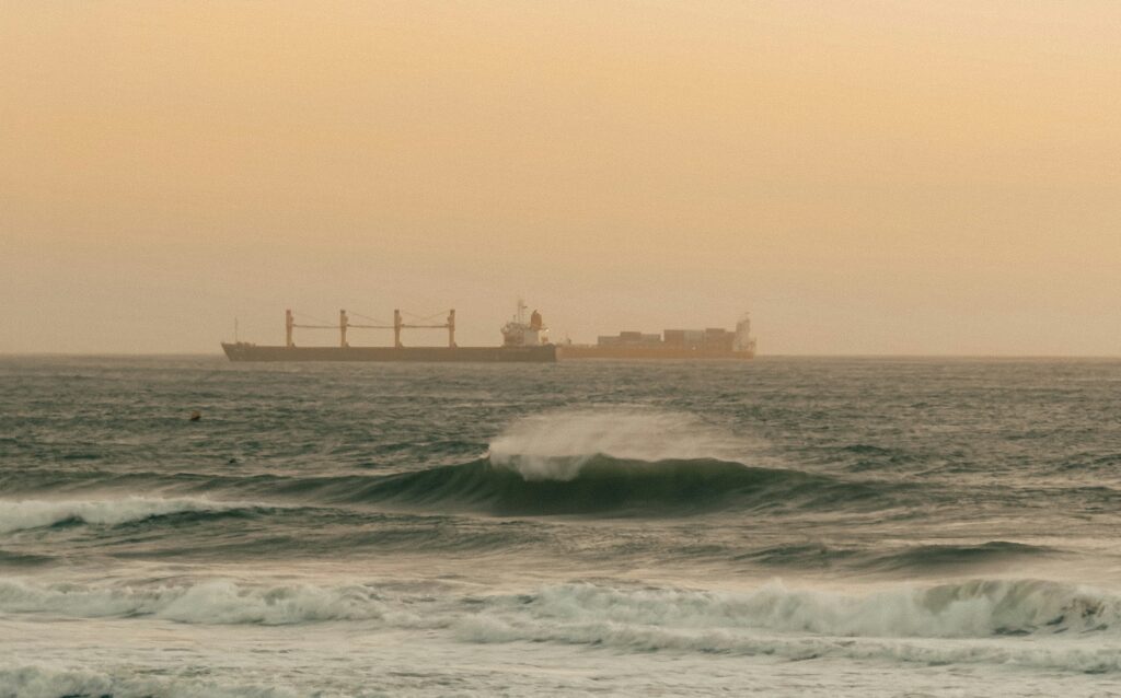 A sandbar break in Anza with the a shipping boat in the background.