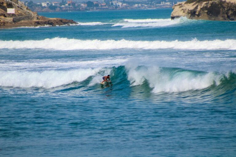 Surfer riding a wave in Ecuador