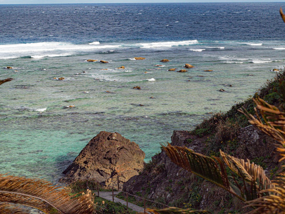 A view of some waves breaking in the background of the photo