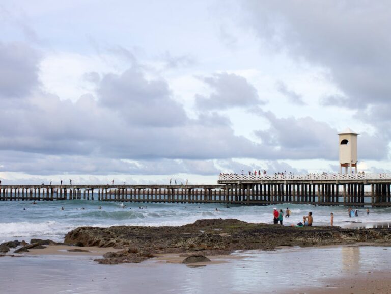 People surfing in the water of Fortaleza Brazil