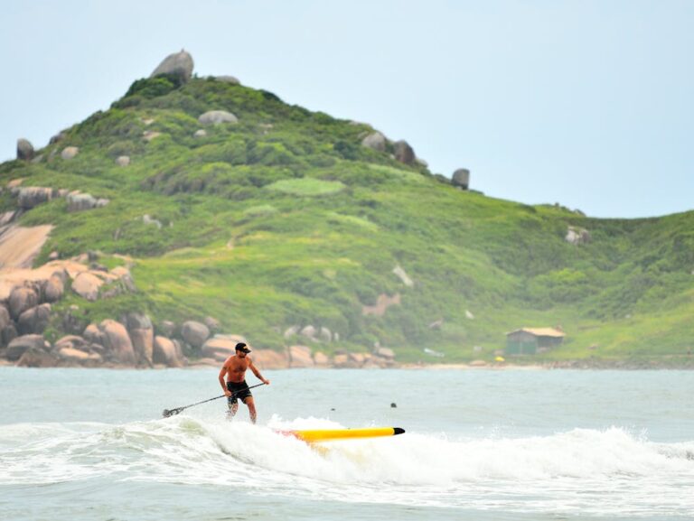 Surfer riding a wave in Barra da Lagoa