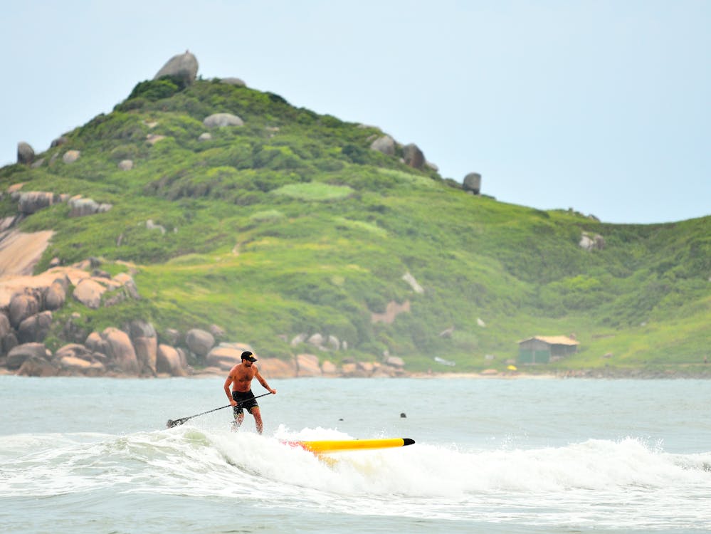 Surfer riding a wave in Barra da Lagoa