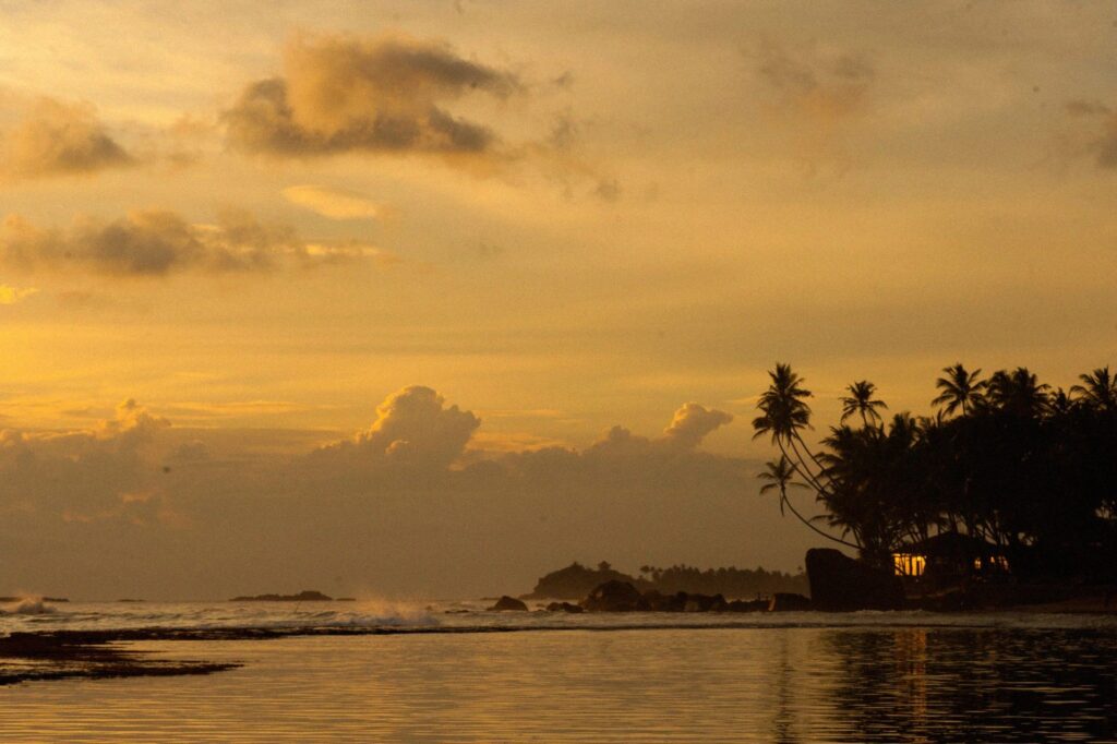 A sunset looking over the cove of Unawatuna.