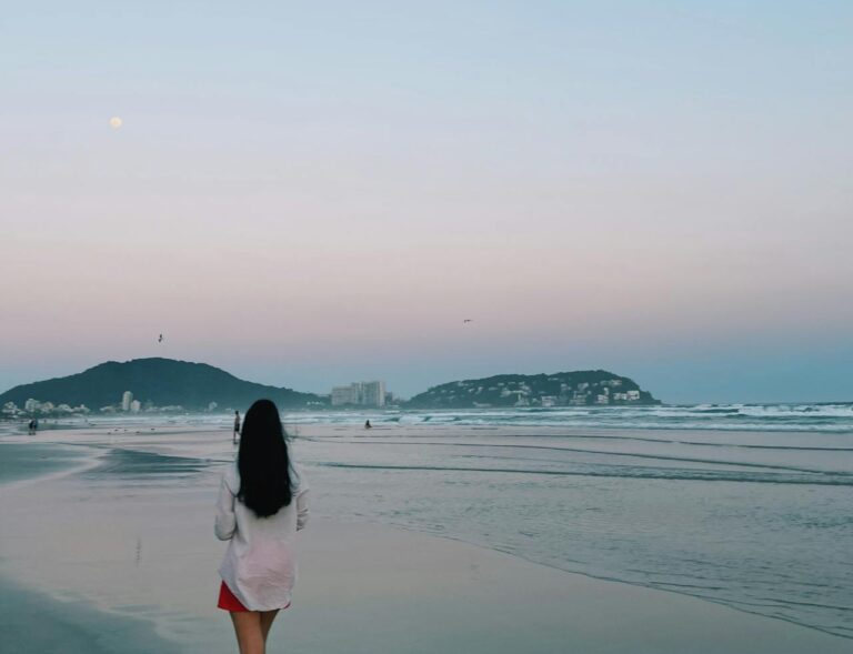 Girl walking on the beach of Itanhaem