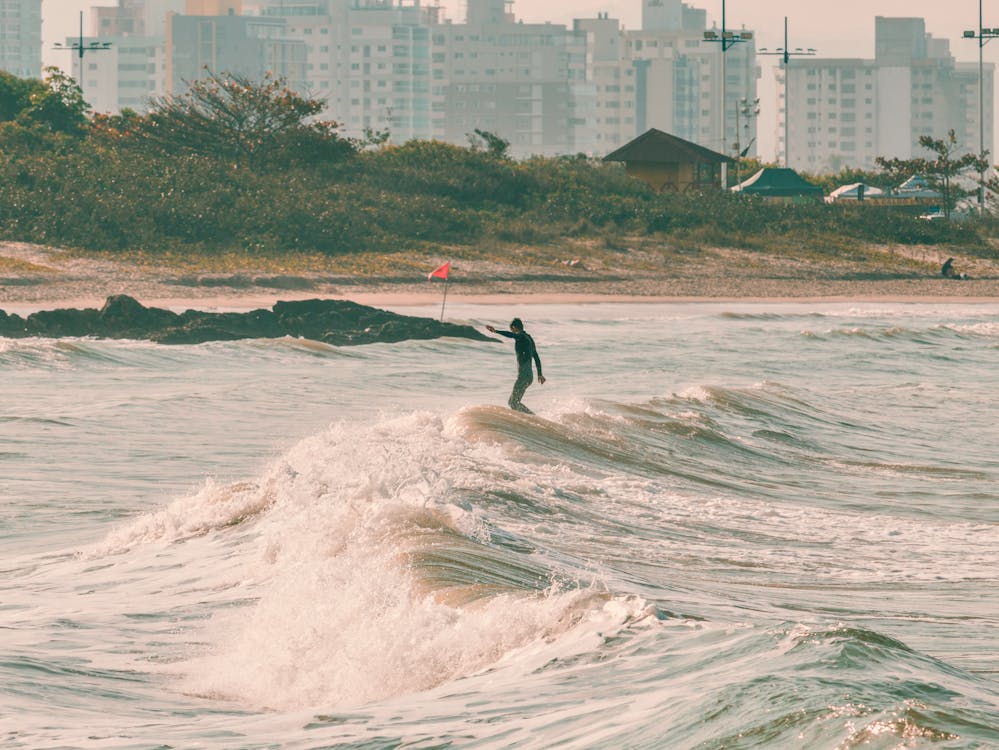 Surfer longboarding a wave in Itapema