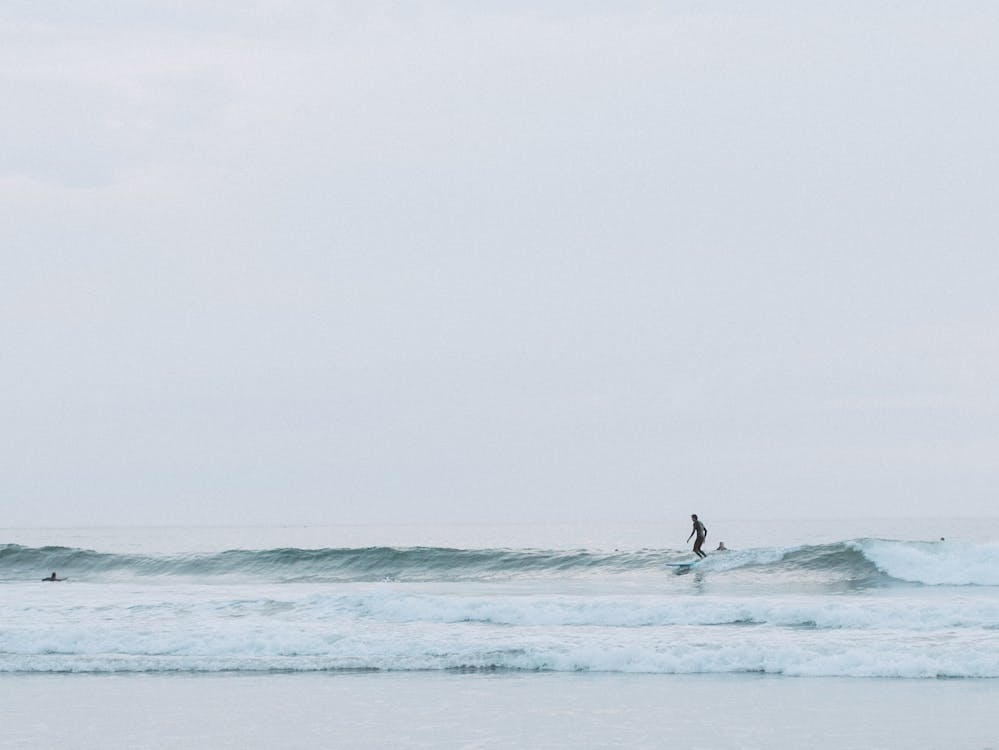 Surfing in Brazil a longboarder walks a wave