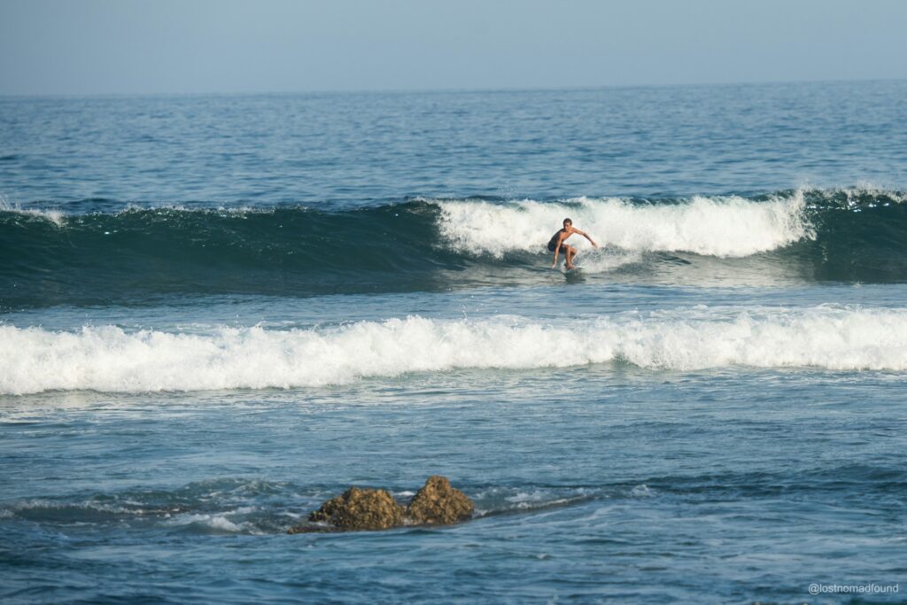 A surfer enjoying a wave along the coastline of San José del Cabo, in Costa Azul.