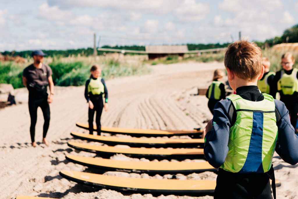A Surflogiet group learning the ropes of surfing.