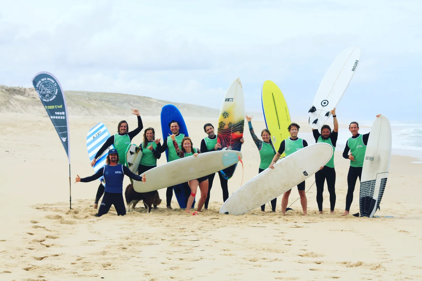 A party group of Saint Giron Surf House enjoying the weather and the surf sessions! Big smiles all around.