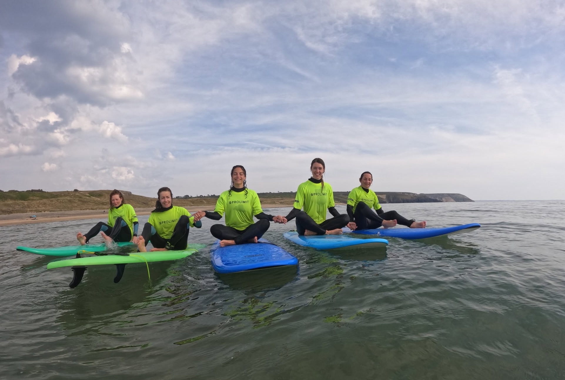Some students enjoying a day in the water with Love Yoga Surf.