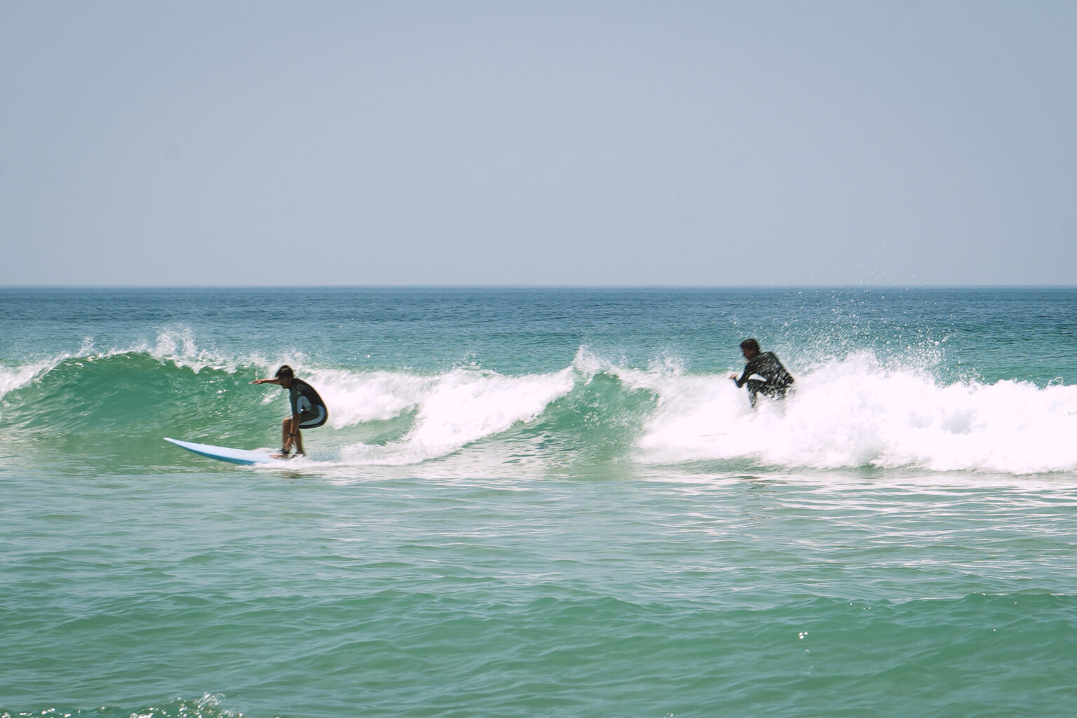 Living life large! A group of students from Imagine Surf School catching some fantastic waves!