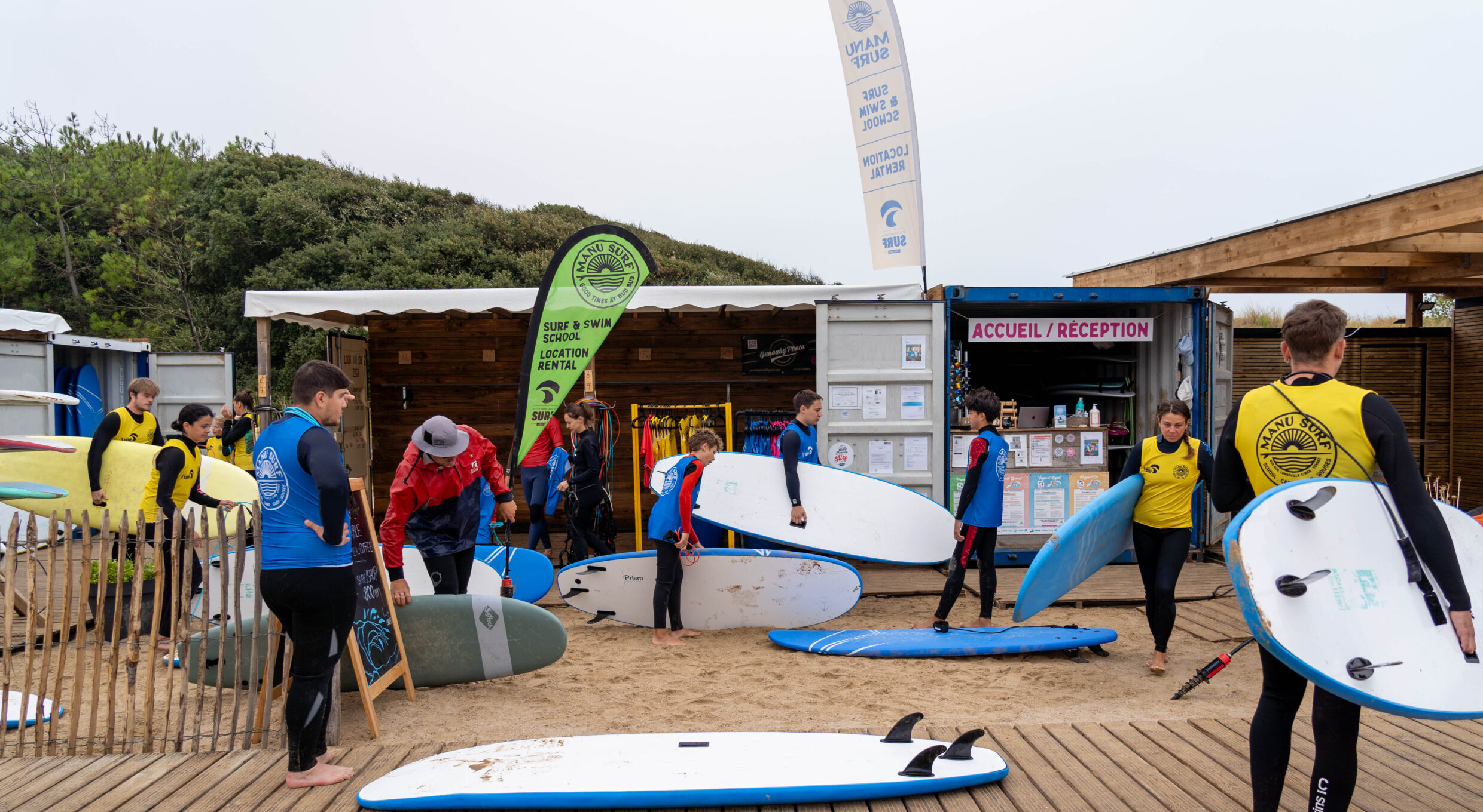 The homebase of Manu Surf, with many beginners getting ready to hop in the water for a fun session.