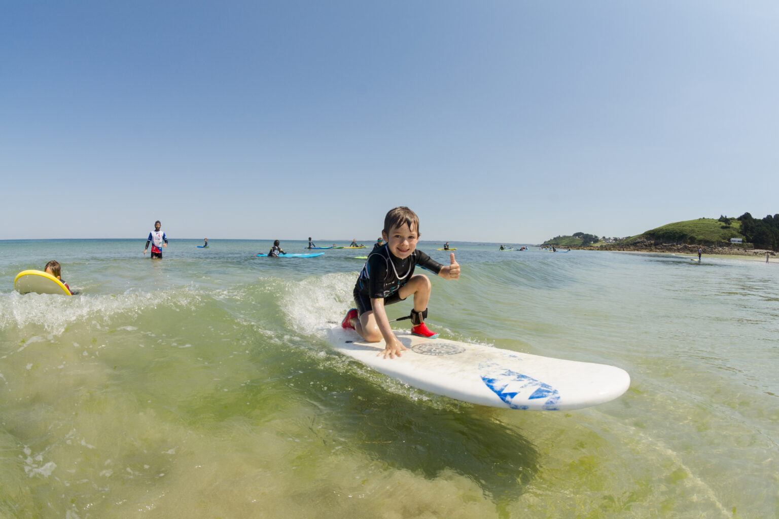 100% Stokage by a grom riding the wave of their lifetime with Surfing Locquirec.