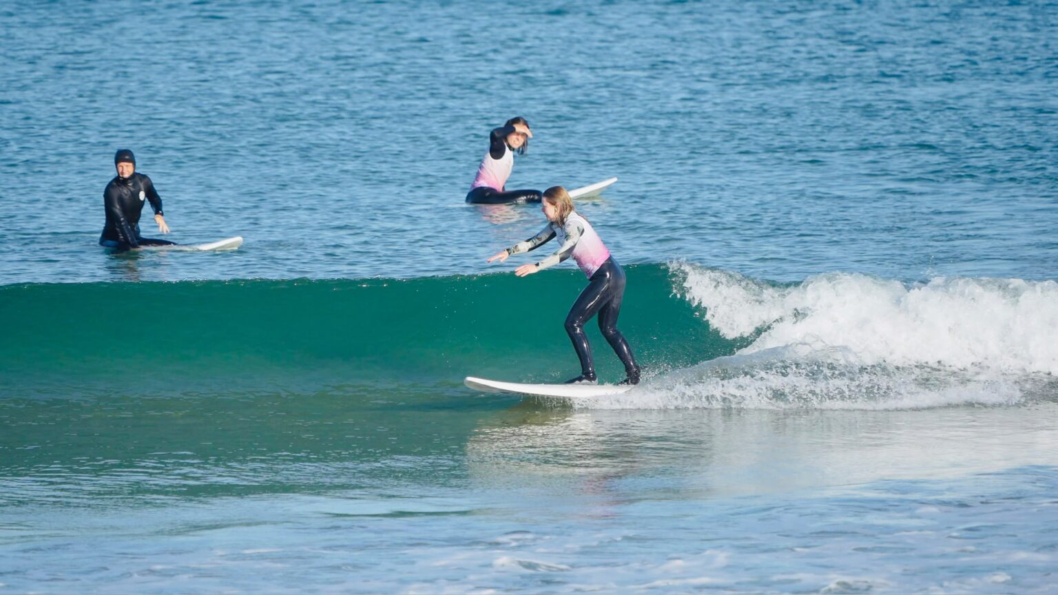 One of the students from Maïa enjoying a wave on the beaches.
