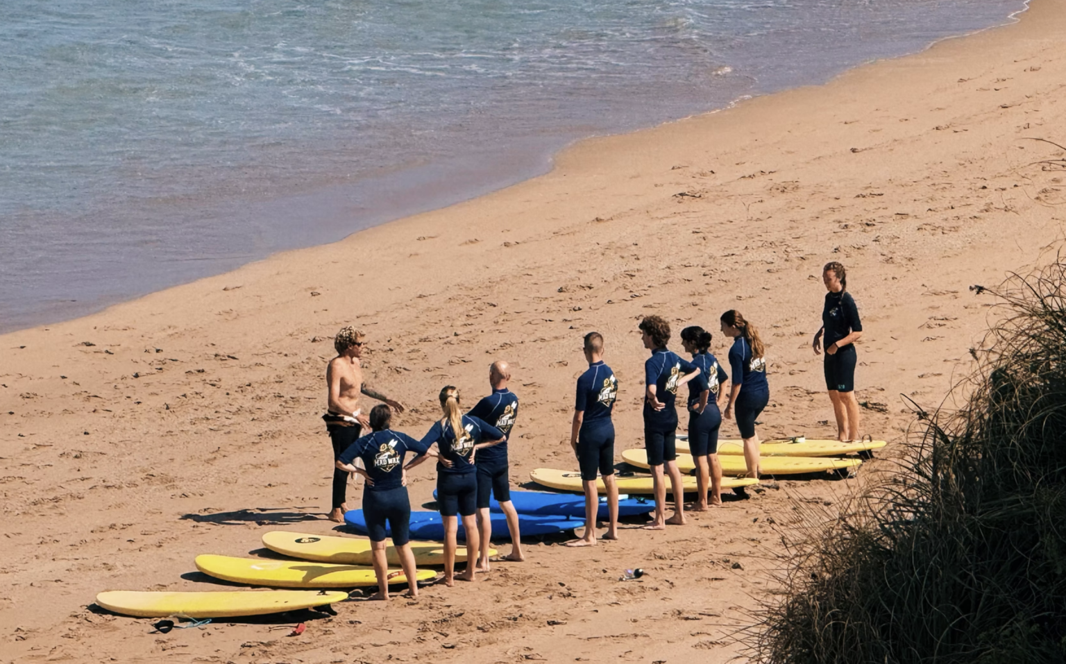 Julien pictured with a group of soon to be Mad Wax Surf School graduates.