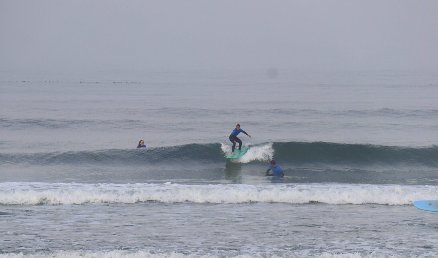 One of the Slide Surf Camp'ers enjoying a wave along Praia da Vagueira.