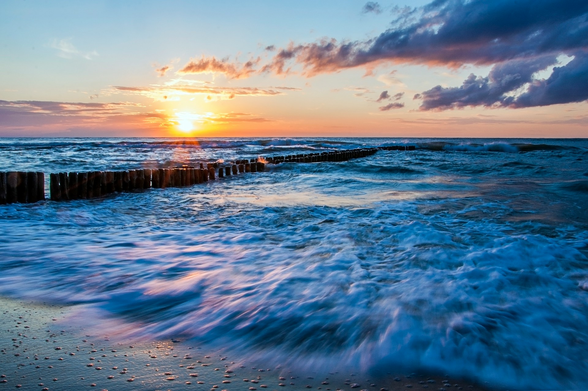 A beautiful sunset taking place over some of the local Wladyslawowo rock pilings.