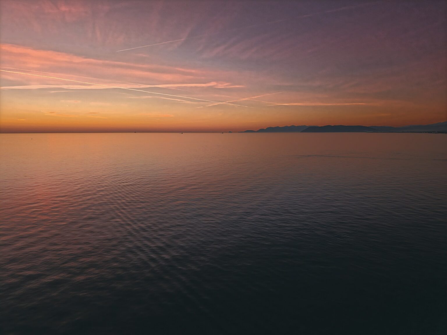 A sunset over the sea of Forte dei Marmi.