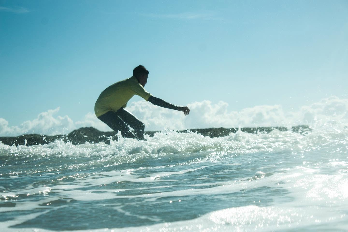A learner from Gosurfing Terschelling enjoying a wave in some warm weather.