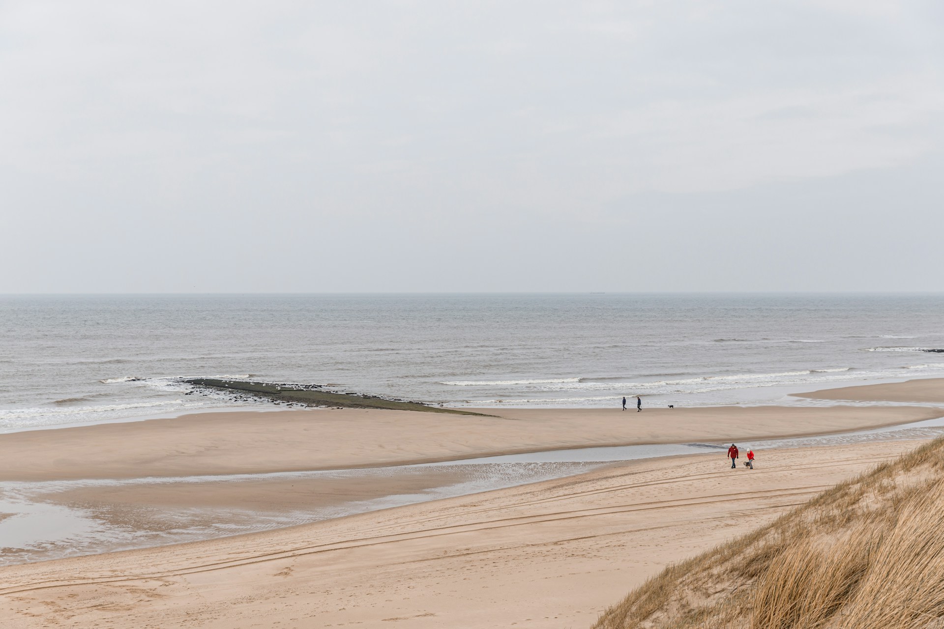 Callantsoog Beach, Netherlands, during a windy day. A beach full of surfing sand bars ready to be traveled too.