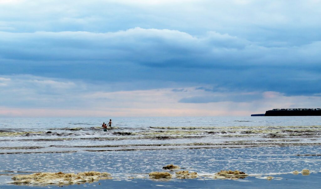 A view of some tiny waves in Lahinch breaking.