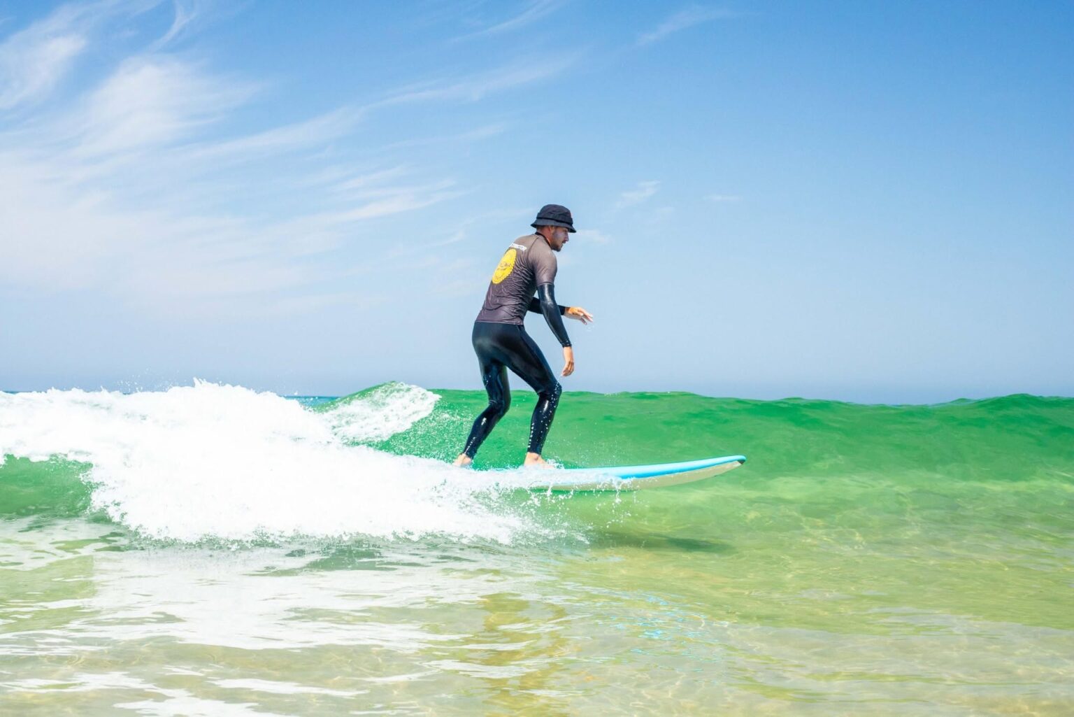 One of the students at Moana Surf School enjoying a ride in some beautiful clear water.