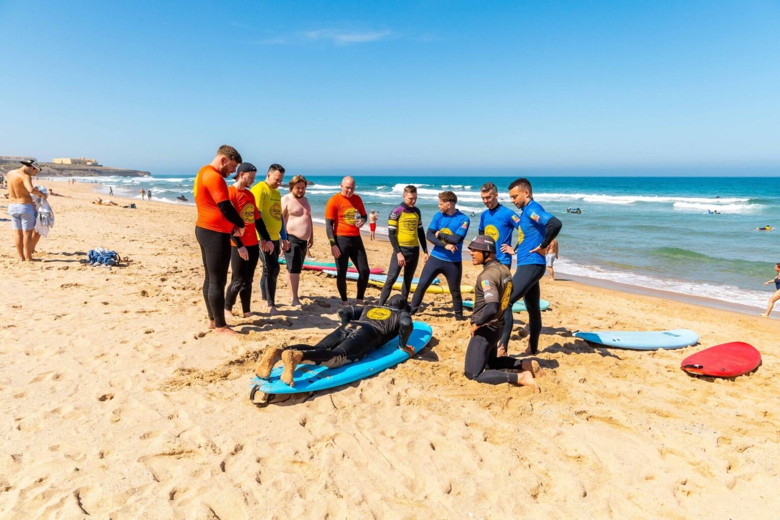 Moana Surf School preparing a group of students to enjoy a day in the water.
