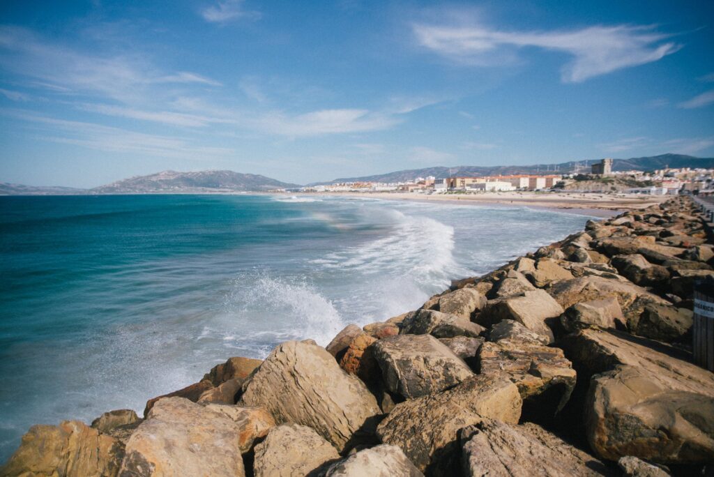 A beautiful view from "Between two Oceans". Waves breaking on the rock pilings near the beach.